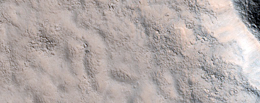 Extended Ejecta in Adamas Labyrinthus