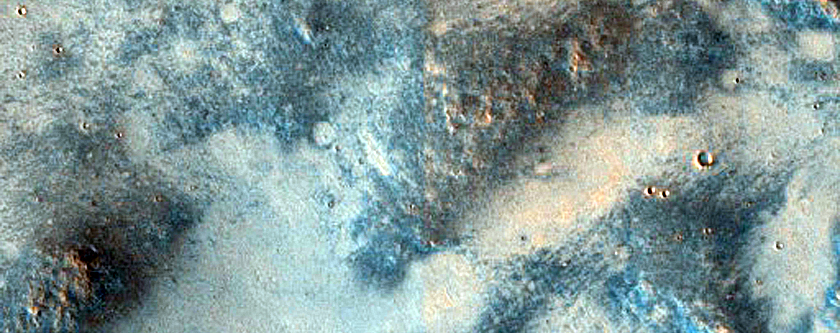 Mafic Minerals Ejected by Small Craters on Syrtis Major Planum