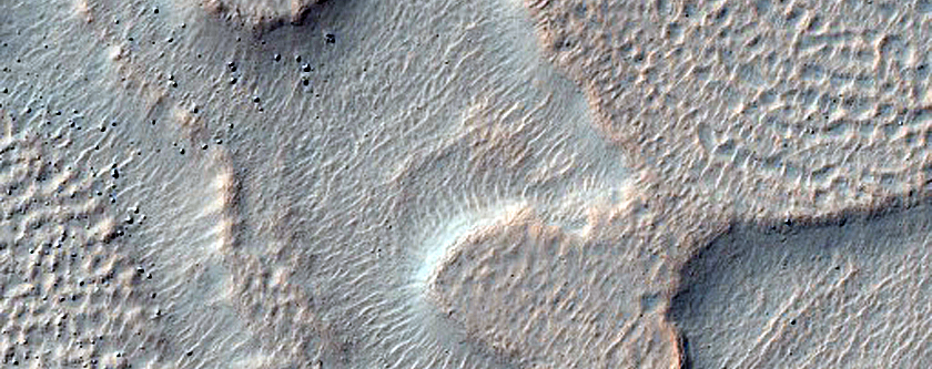 Crater Superimposed on Rim of Larger Crater
