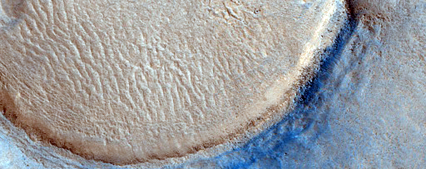 Dipping Layers in Crater in Deuteronilus Mensae