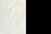 Layered Material in Idaeus Fossae Crater Wall