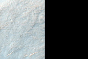 Possible Olivine-Bearing Materials around Craters in Hesperia Planum