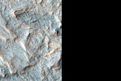 Pyroxene-Rich Materials Surrounding Crater in Northeast Hellas Planitia