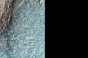 Banded Terrain and Layering in Hellas Planitia