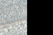 Channel Feature Into Degraded Crater in Deuteronilus Mensae