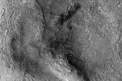 Hydrated Silicon-Rich Terrain in West Hellas Planitia