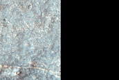 Pyroxene-Rich Materials Surrounding Crater in Northeast Hellas Planitia