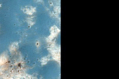 Phyllosilicate-Rich Terrain Exposed by Crater North of Hellas Planitia