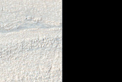 Crater and Banded Terrain in Hellas Planitia