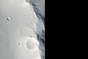 Elliptical Crater with Butterfly-Shaped Ejecta near Uranius Dorsum