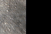 Dipping Layered Feature along Valley in Arabia Terra