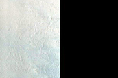 Impact Crater Exposing Bedrock