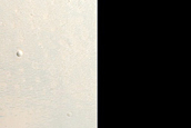 Mafic Minerals Exposed by Crater on Western Syrtis Major Planum