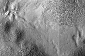 Gullies and Flow Features along Crater Wall in Promethei Terra