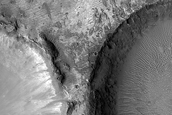 Diverse Materials Exposed by Well-Exposed Crater off Her Desher Vallis