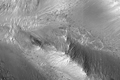 Slope Features on Orson Welles Crater Wall