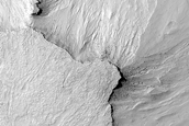 Possible Slope Features in Eroded Crater Fill Material