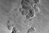 Pits in Mantle Deposit