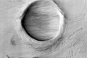 Crater and Banded Terrain in Hellas Planitia