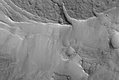Steep-Front Deposit with Light-Toned Layers in Northern Arabia Terra