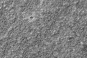Monitoring New Small South Polar Layered Deposits Crater