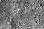 Layered Materials at Deepest Point of Crater Fed by Channels