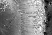 Layered Stratigraphy Exposed in Crater Wall
