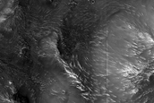 Proximal Mpact Related Deposits and Flows Northeast of Hellas Planitia