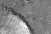 Impact Related Deposits and Flows West of Esira Crater