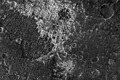 Light-Toned Deposit in Crater adjacent to Candor Chasma