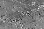 Dark Wind Streaks in Tharsis Region