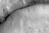 Dipping Layers in Crater in Deuteronilus Mensae
