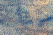 Crater in Aonia Terra