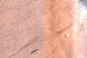 Layers in Pedestal Crater along Rim of Tikhonravov Crater