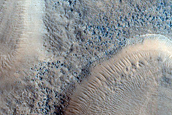 Layered Features in Craters in Northern Mid-Latitudes