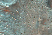Possible Phyllosilicates in Terra Tyrrhena Crater Ejecta