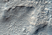 Layered Feature in Pedestal Crater in Hellas Planitia