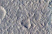 Lighter-Toned Deposits in Young Crater