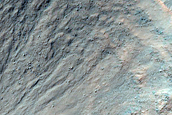Gullies in 2-Kilometer Diameter Crater with Bright Rock Outcrops