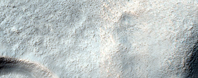 Layered Features in Craters in Promethei Terra