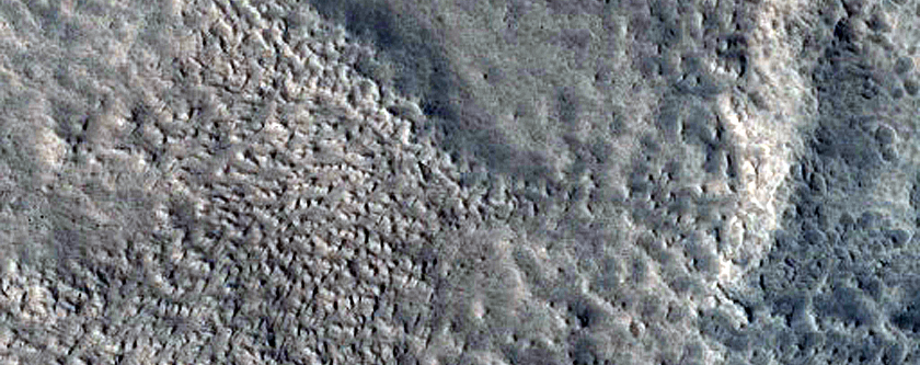North-Pole-Facing Deposit in Crater Associated with Headwall Erosion