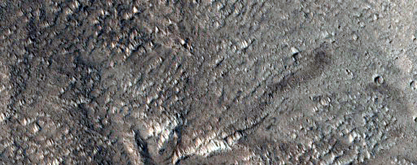 North-Pole-Facing Deposit in Crater Associated with Headwall Erosion