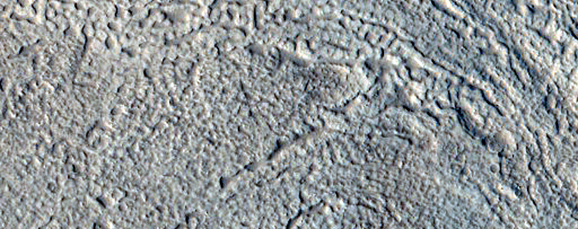 North-Pole-Facing Deposit in Crater Associated with Headwall Erosion