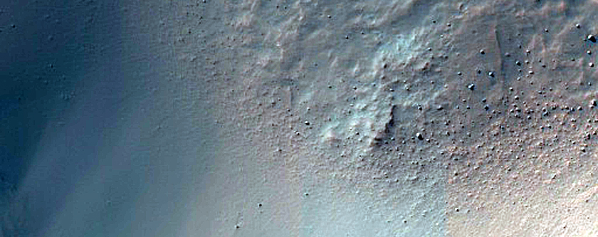 Crater-Related Pitted Materials in 4-Kilometer Crater near Hellas Planitia