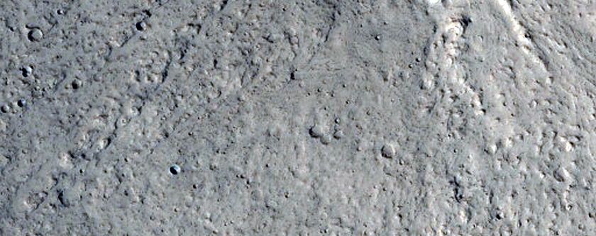 North-Pole-Facing Deposit in Crater Associated with Headwall Erosion