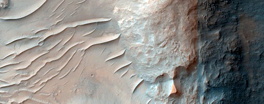 Fractured Crater Floor with Altered Minerals