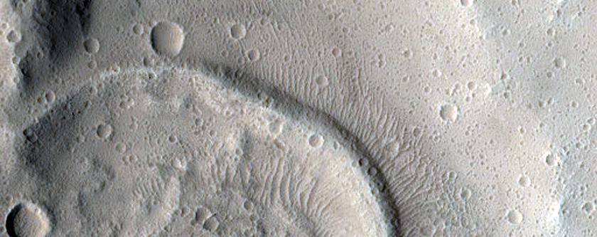 North-Pole-Facing Deposit in Crater Associated with Headwall Erosion