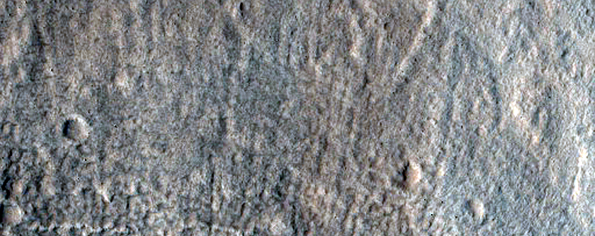 North-Pole-Facing Deposit in Crater Associated with Headwall Erosion