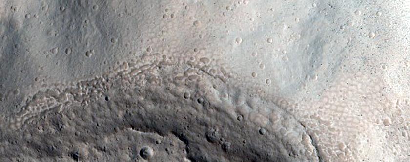 North-Pole-Facing Deposit in Crater Associated with Headwall Erosion