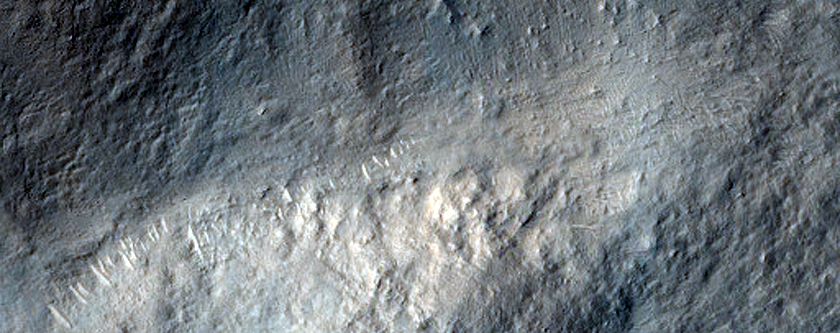 Crater Rim Clipped by Linear Feature